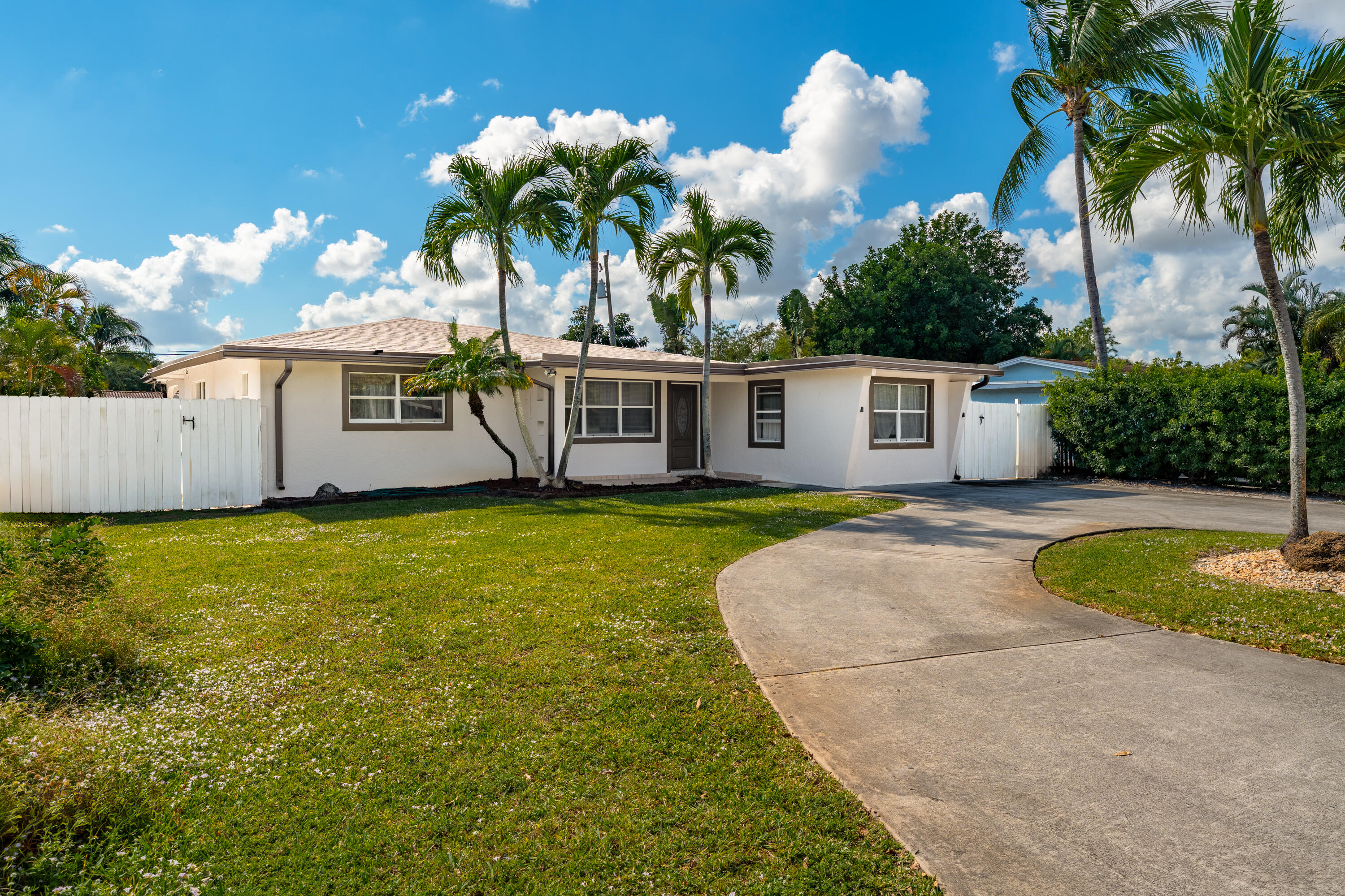 250 Northwest 11th Street Boca Raton, FL 33432 - Photo 1 of 30 a view of a house with pool and a yard