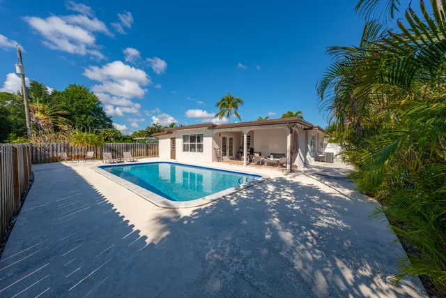 a view of a backyard with a patio