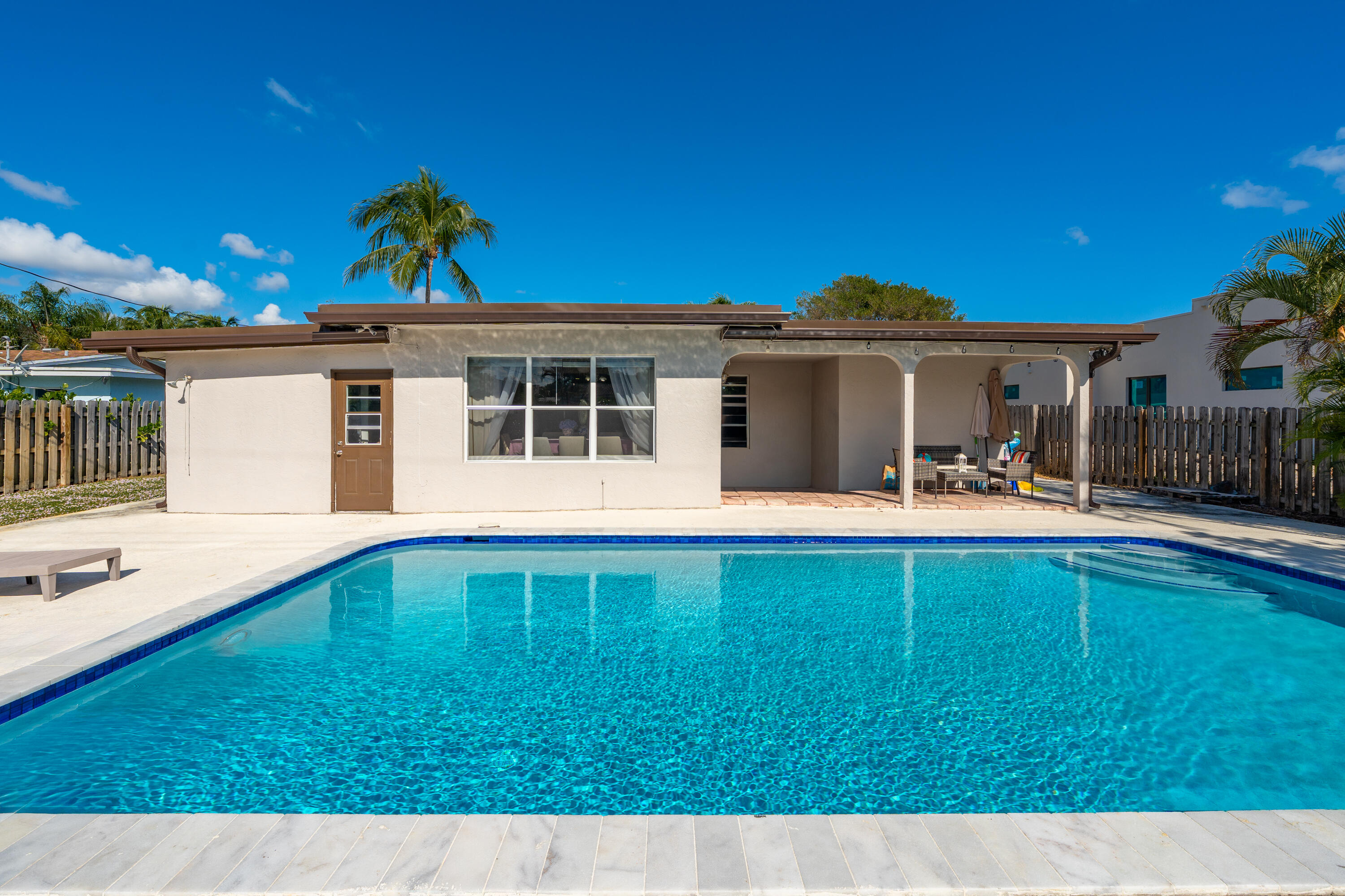 250 Northwest 11th Street Boca Raton, FL 33432 - Photo 29 of 30 a view of a house with swimming pool and porch