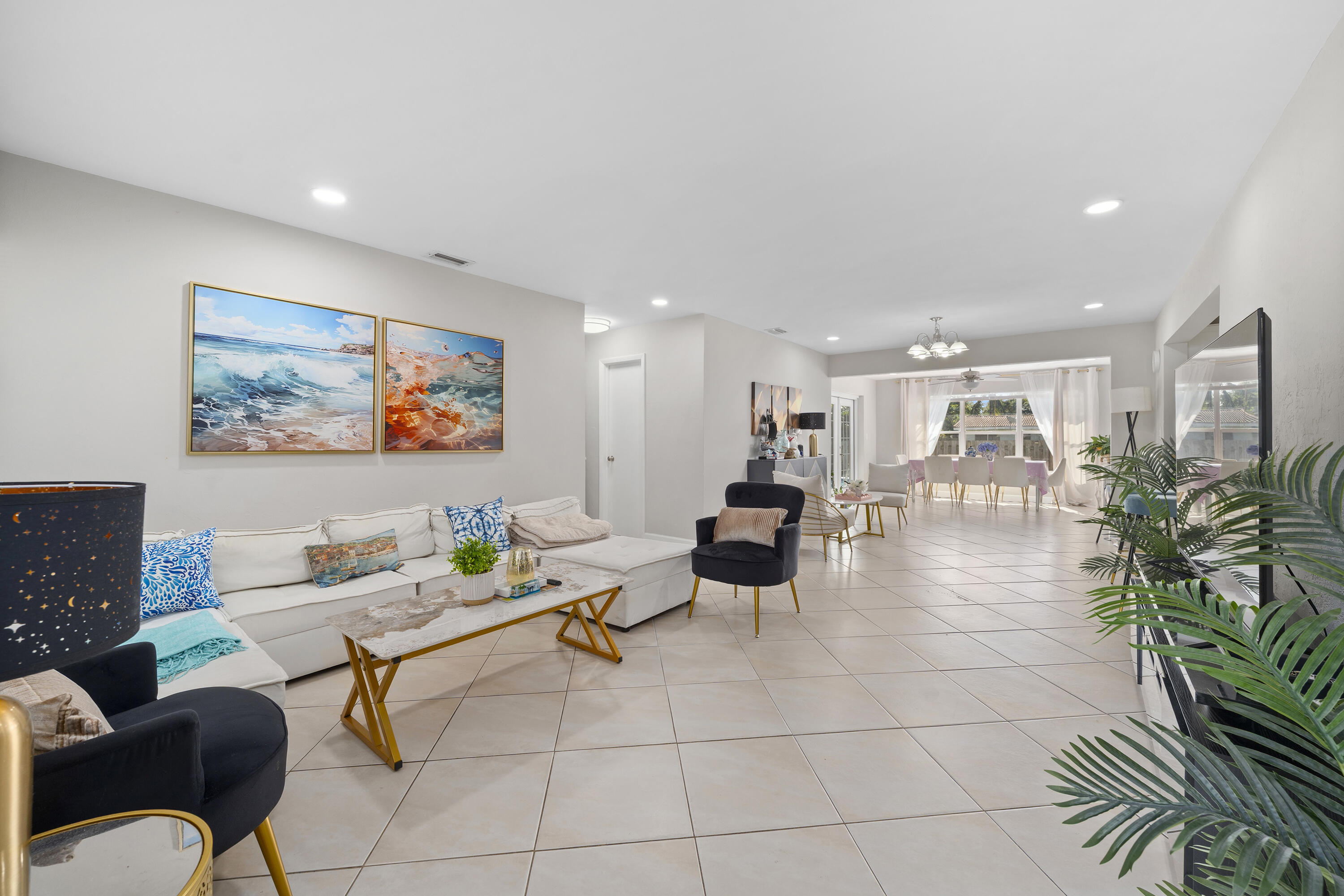 250 Northwest 11th Street Boca Raton, FL 33432 - Photo 5 of 30 a living room with furniture and a painting on the wall