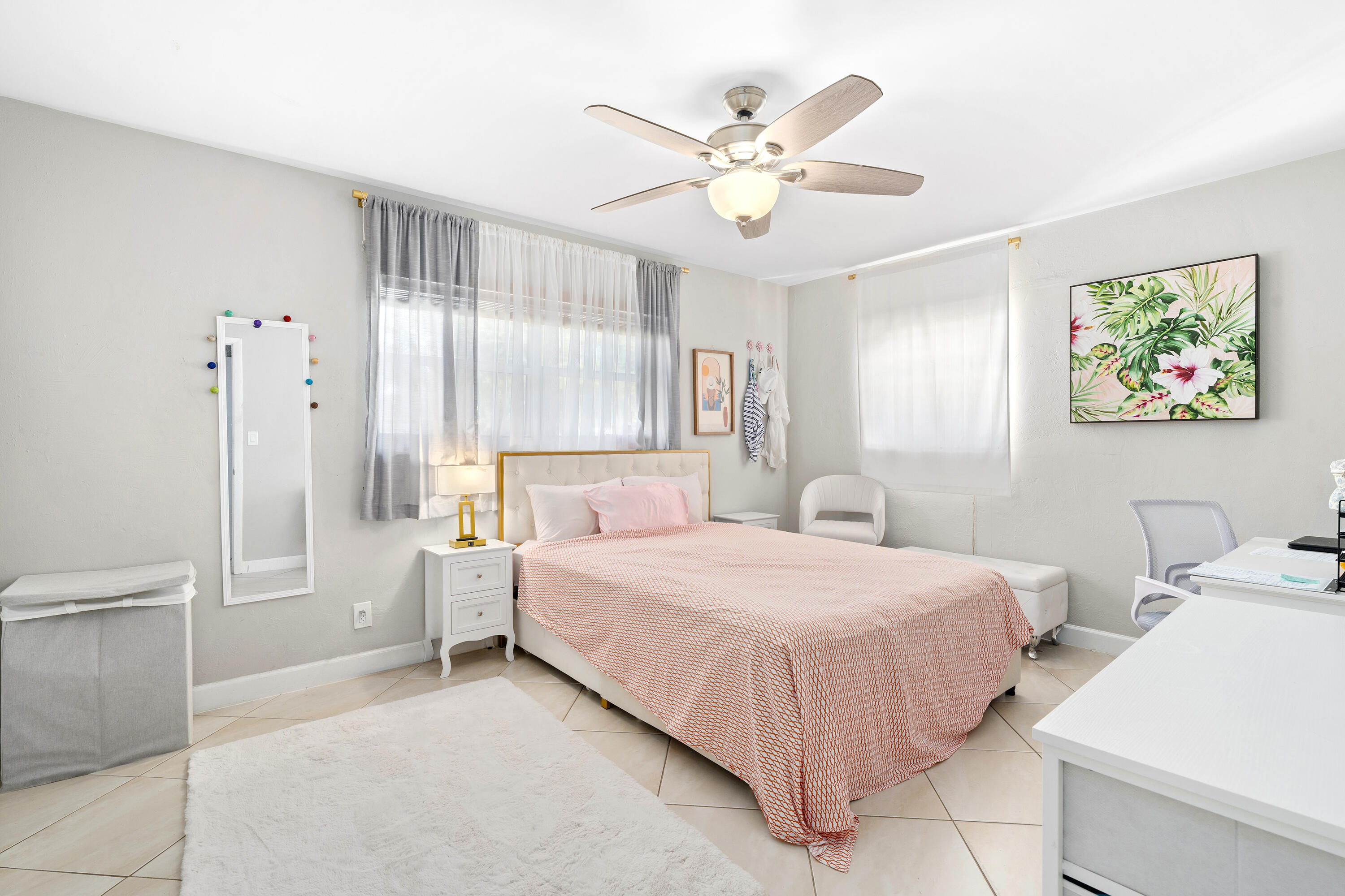 250 Northwest 11th Street Boca Raton, FL 33432 - Photo 9 of 30 a bedroom with a bed and a chandelier