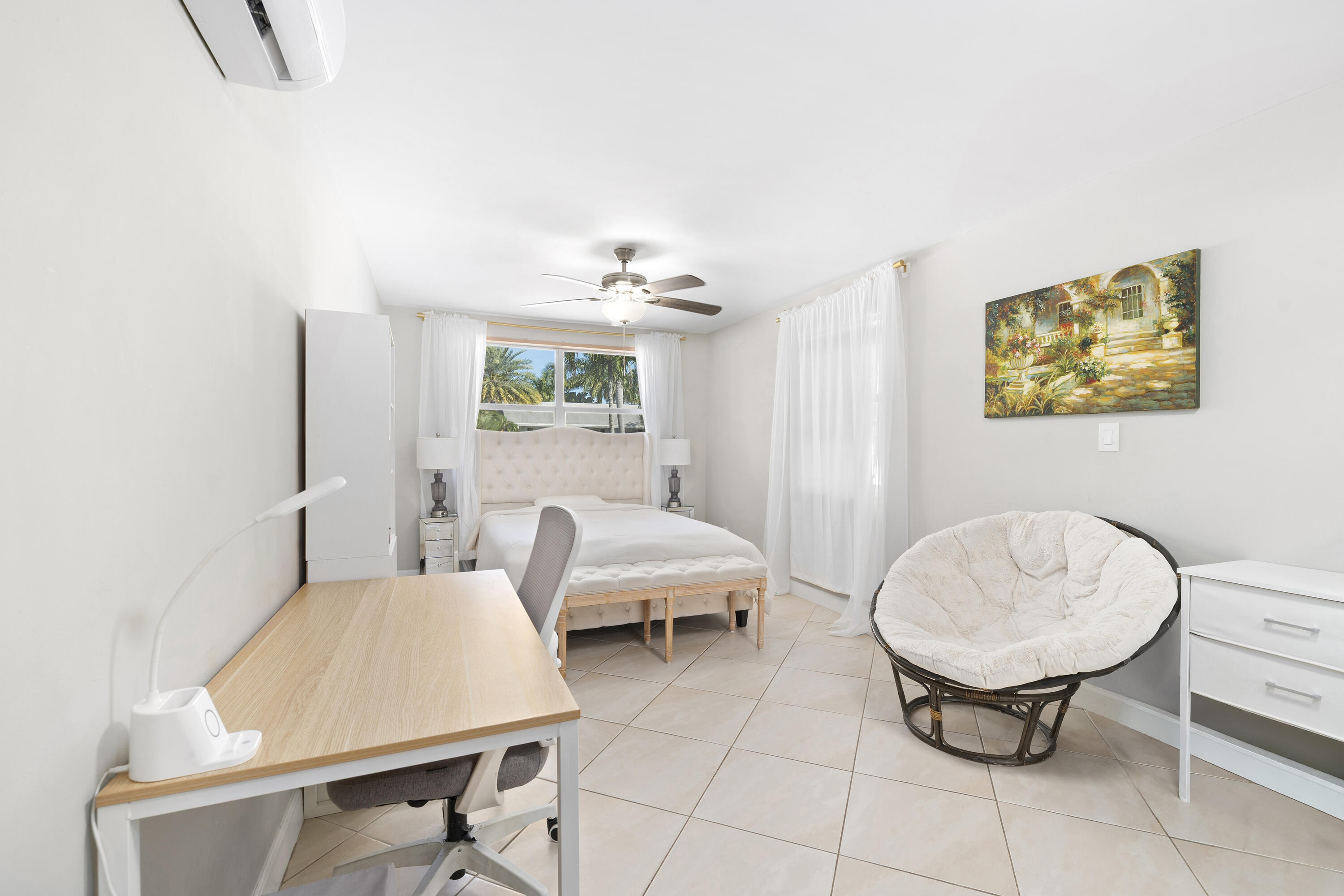 250 Northwest 11th Street Boca Raton, FL 33432 - Photo 10 of 30 a living room with furniture and a painting on the wall