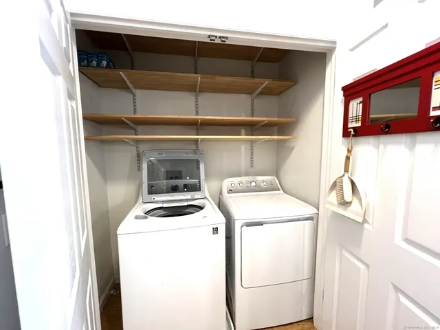 a lobby with furniture window and wooden floor