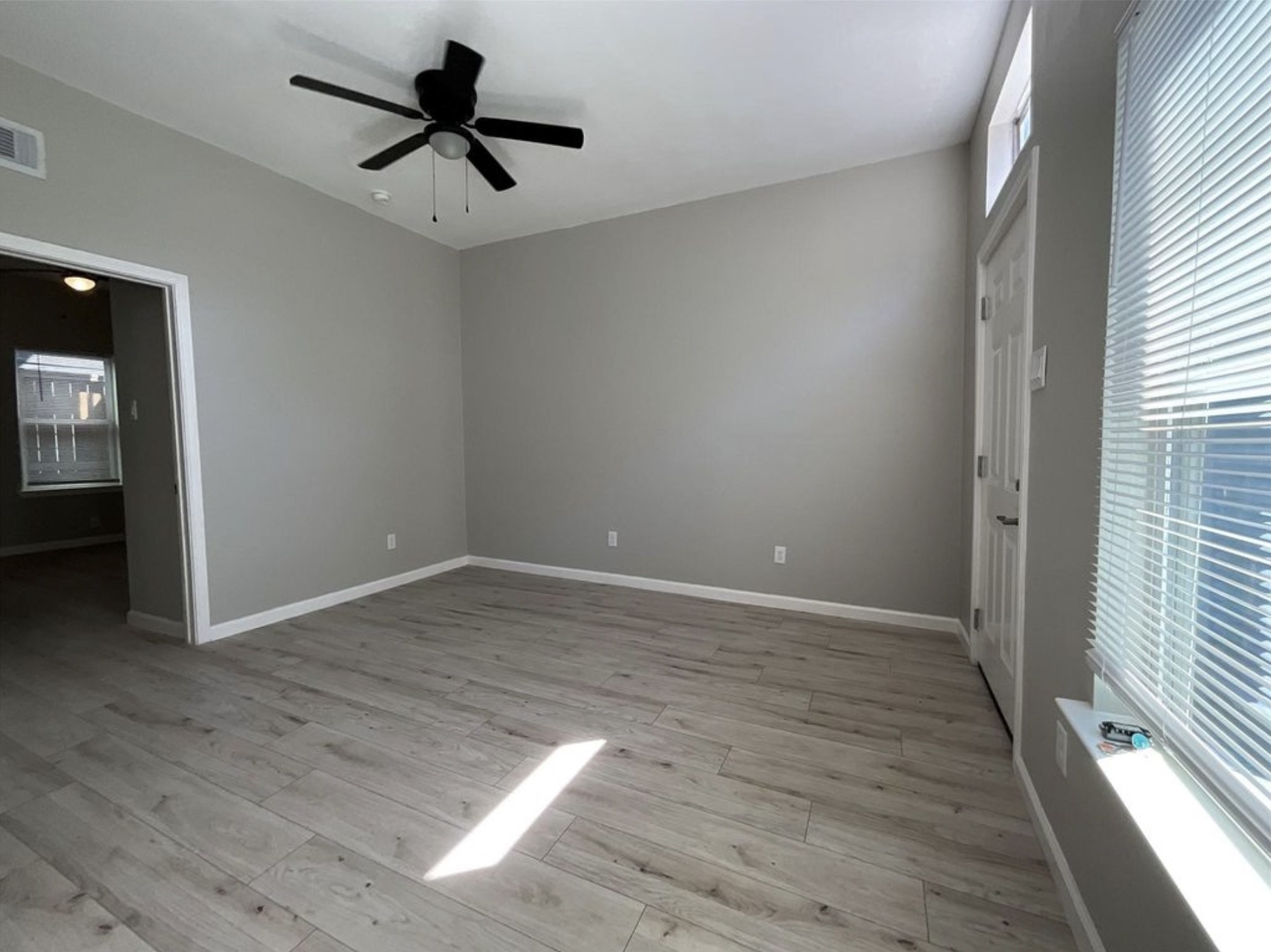 3403 Yupon Street Houston, TX 77006 - Photo 13 of 29 wooden floor in an empty room with a window