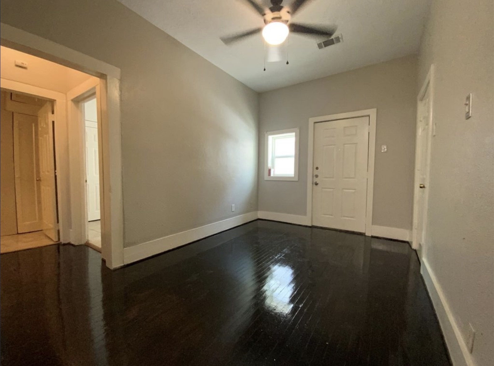 3403 Yupon Street Houston, TX 77006 - Photo 28 of 29 an empty room with wooden floor and windows