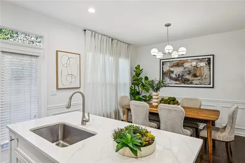 a room with pool table and mirrors