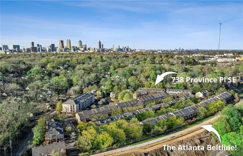 a kitchen with a sink and a stove top oven