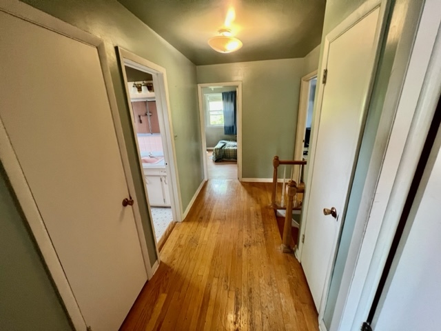 1243 Hillview Road Homewood, IL 60430 - Photo 13 of 23 a view of a hallway with wooden floor and staircase