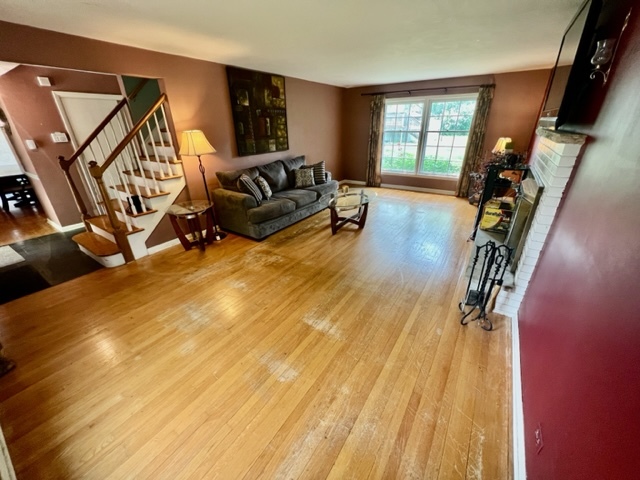 1243 Hillview Road Homewood, IL 60430 - Photo 18 of 23 a living room with furniture floor to ceiling window and a wooden floor