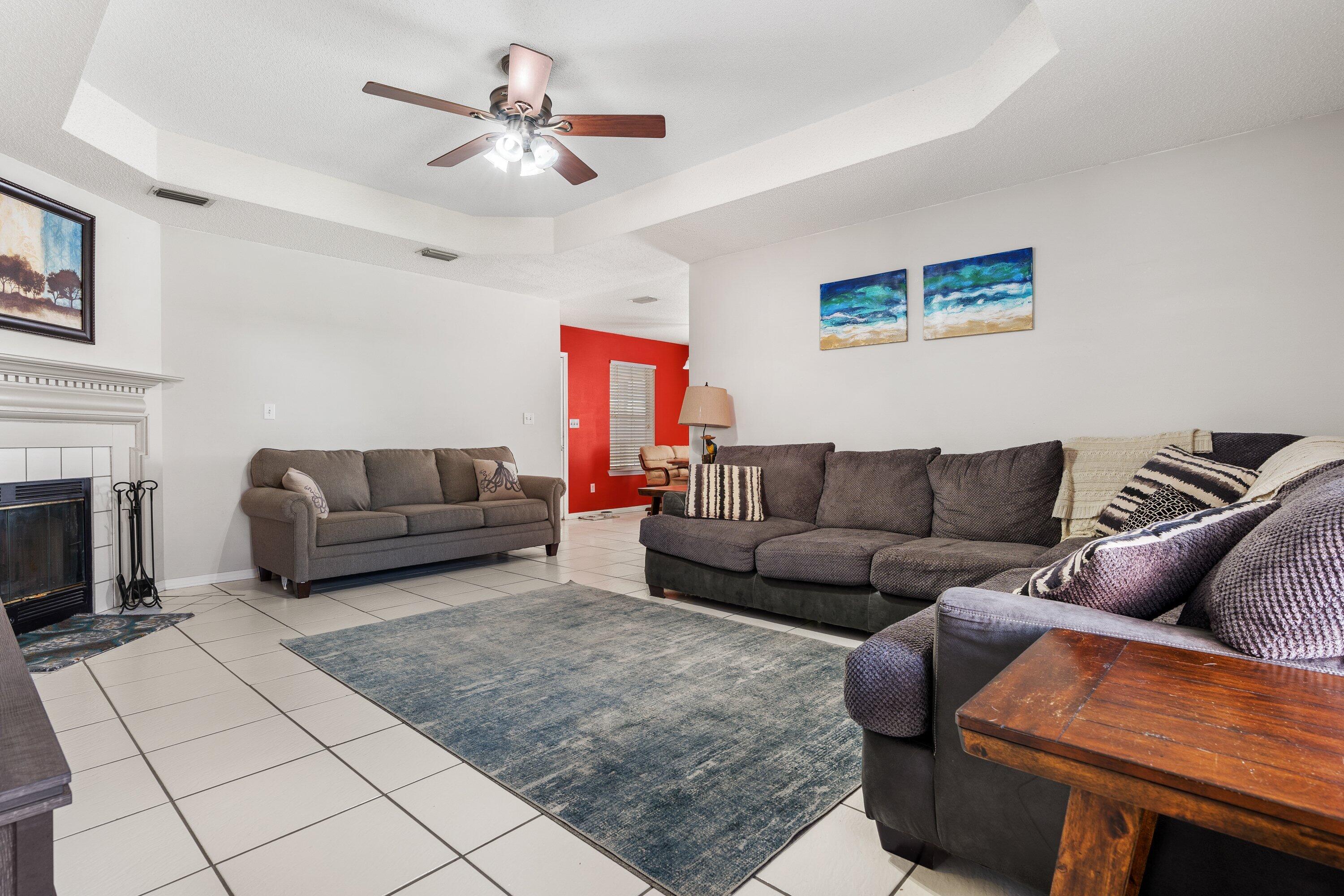 1761 Old Ranch Road Fort Walton Beach, FL 32547 - Photo 5 of 33 a living room with furniture and a fireplace