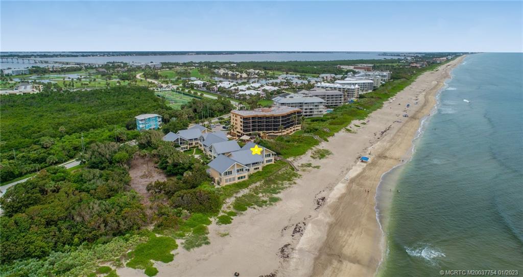 245 Northeast MacArthur Boulevard, Unit 5 Stuart, FL 34996 - Photo 1 of 38 a view of a city and ocean view
