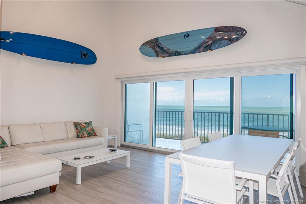 245 Northeast MacArthur Boulevard, Unit 5 Stuart, FL 34996 - Photo 23 of 38 a living room with furniture