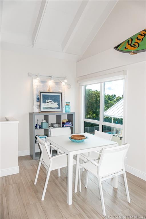 245 Northeast MacArthur Boulevard, Unit 5 Stuart, FL 34996 - Photo 29 of 38 a view of a dining room with furniture window and outside view