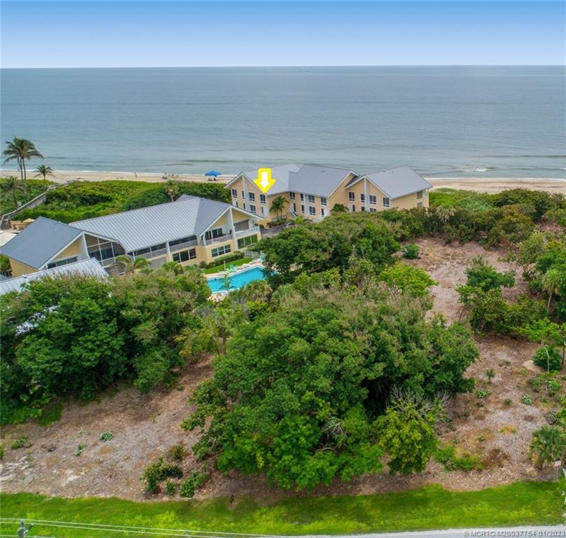 245 Northeast MacArthur Boulevard, Unit 5 Stuart, FL 34996 - Photo 5 of 38 a aerial view of a house with a yard basket ball court and outdoor seating