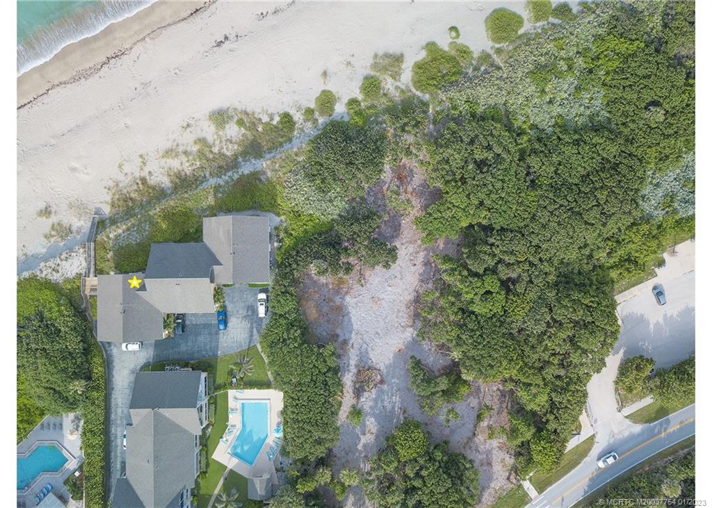 245 Northeast MacArthur Boulevard, Unit 5 Stuart, FL 34996 - Photo 6 of 38 an aerial view of a house with outdoor space