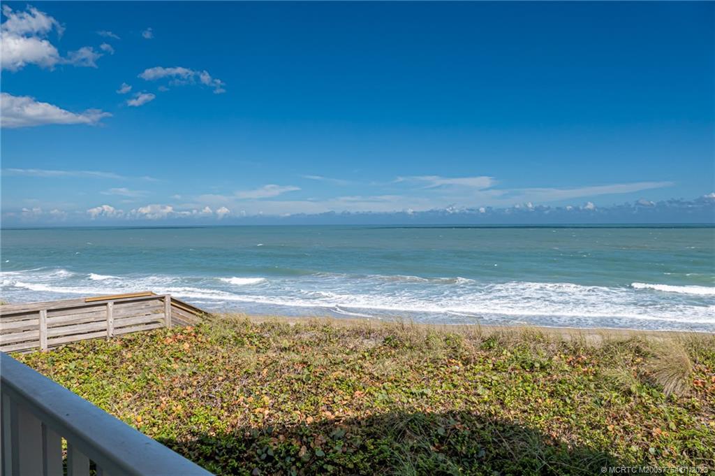 245 Northeast MacArthur Boulevard, Unit 5 Stuart, FL 34996 - Photo 9 of 38 a view of an ocean from a balcony