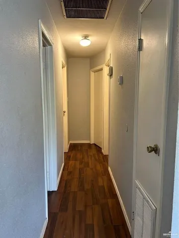 a view of a kitchen with a sink and a stove top oven