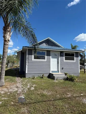 a front view of house with yard