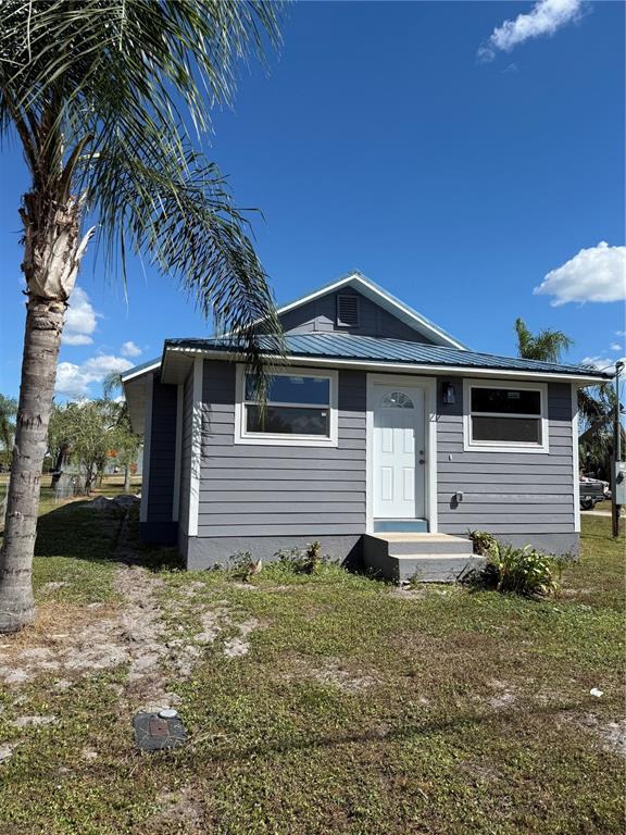 103 South Roger Avenue Arcadia, FL 34266 - Photo 1 of 22 a front view of house with yard