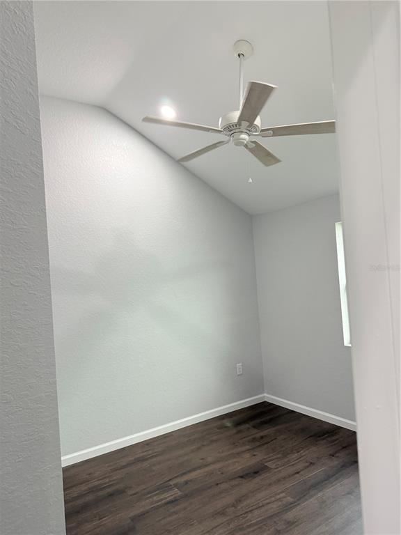 103 South Roger Avenue Arcadia, FL 34266 - Photo 15 of 22 an empty room with wooden floor and fan