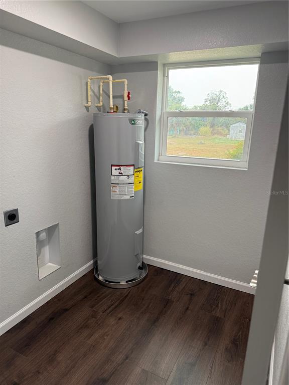 103 South Roger Avenue Arcadia, FL 34266 - Photo 19 of 22 a view of an empty room with wooden floor and a window
