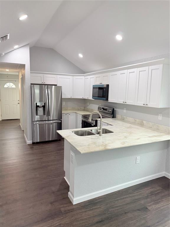 103 South Roger Avenue Arcadia, FL 34266 - Photo 9 of 22 a kitchen with stainless steel appliances granite countertop a refrigerator stove microwave and sink