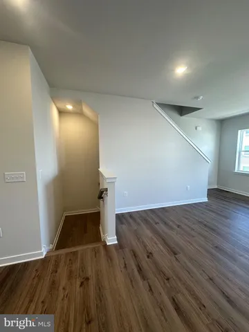 a large kitchen with stainless steel appliances granite countertop a large counter top and a stove