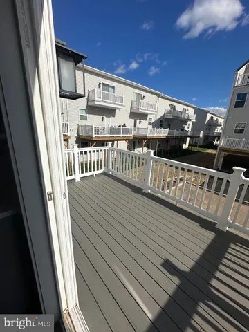 a view of balcony with wooden floor