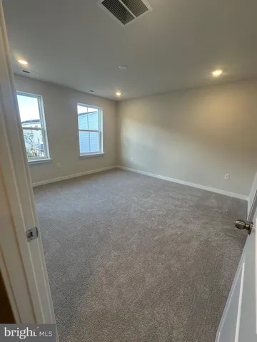 a view of room with window and hardwood floor