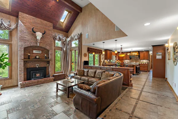 a kitchen with granite countertop a stove and a microwave