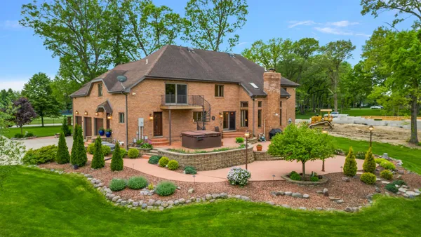 a view of house with outdoor space and seating area