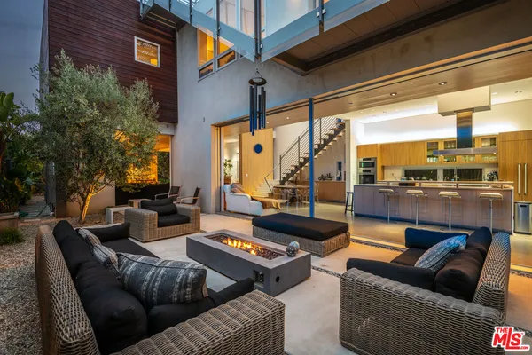 a outdoor living space with patio furniture and a potted plant