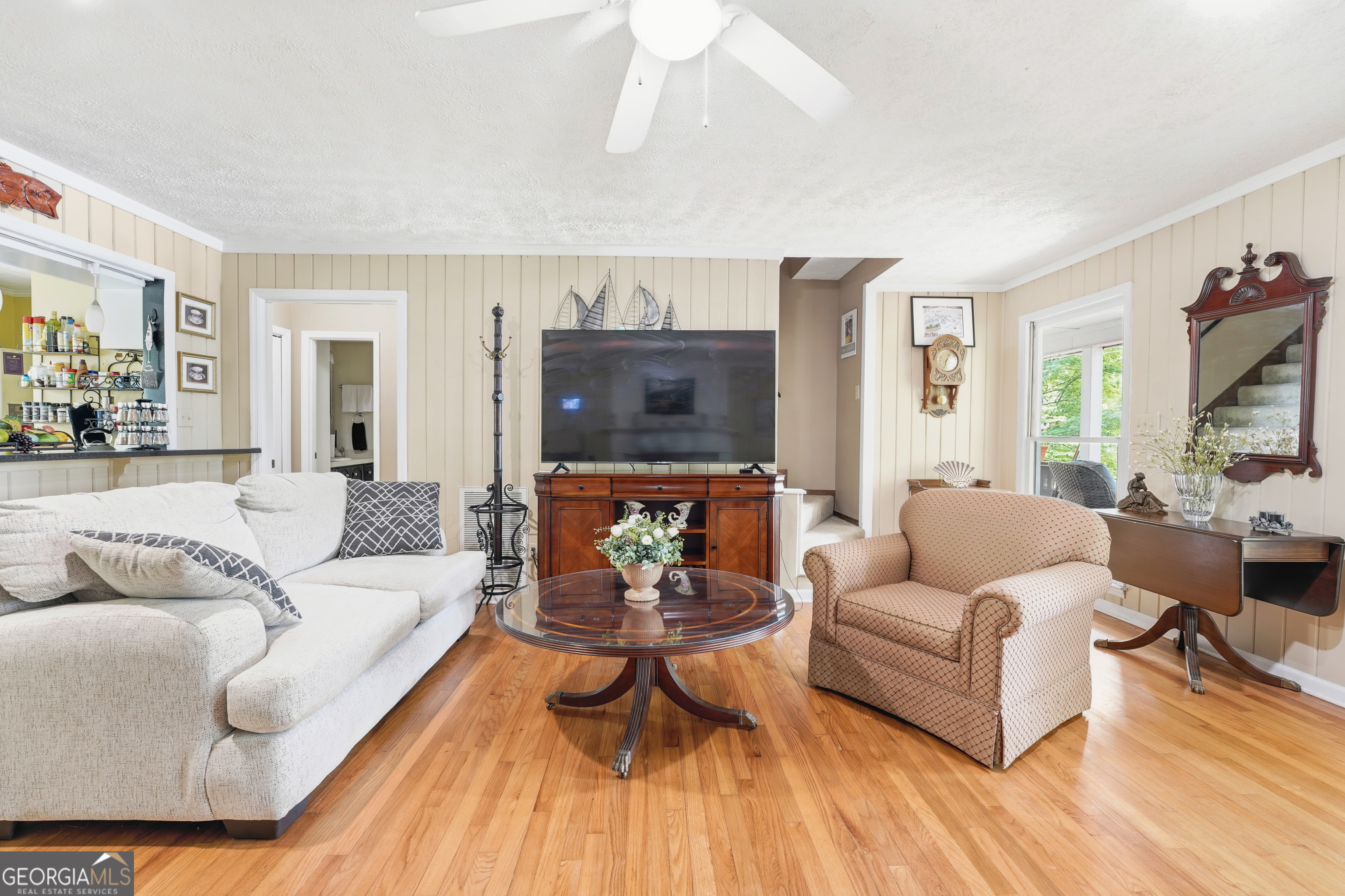 142 Tanglewood Road Southwest Eatonton, GA 31024 - Photo 13 of 50 a living room with furniture and a flat screen tv