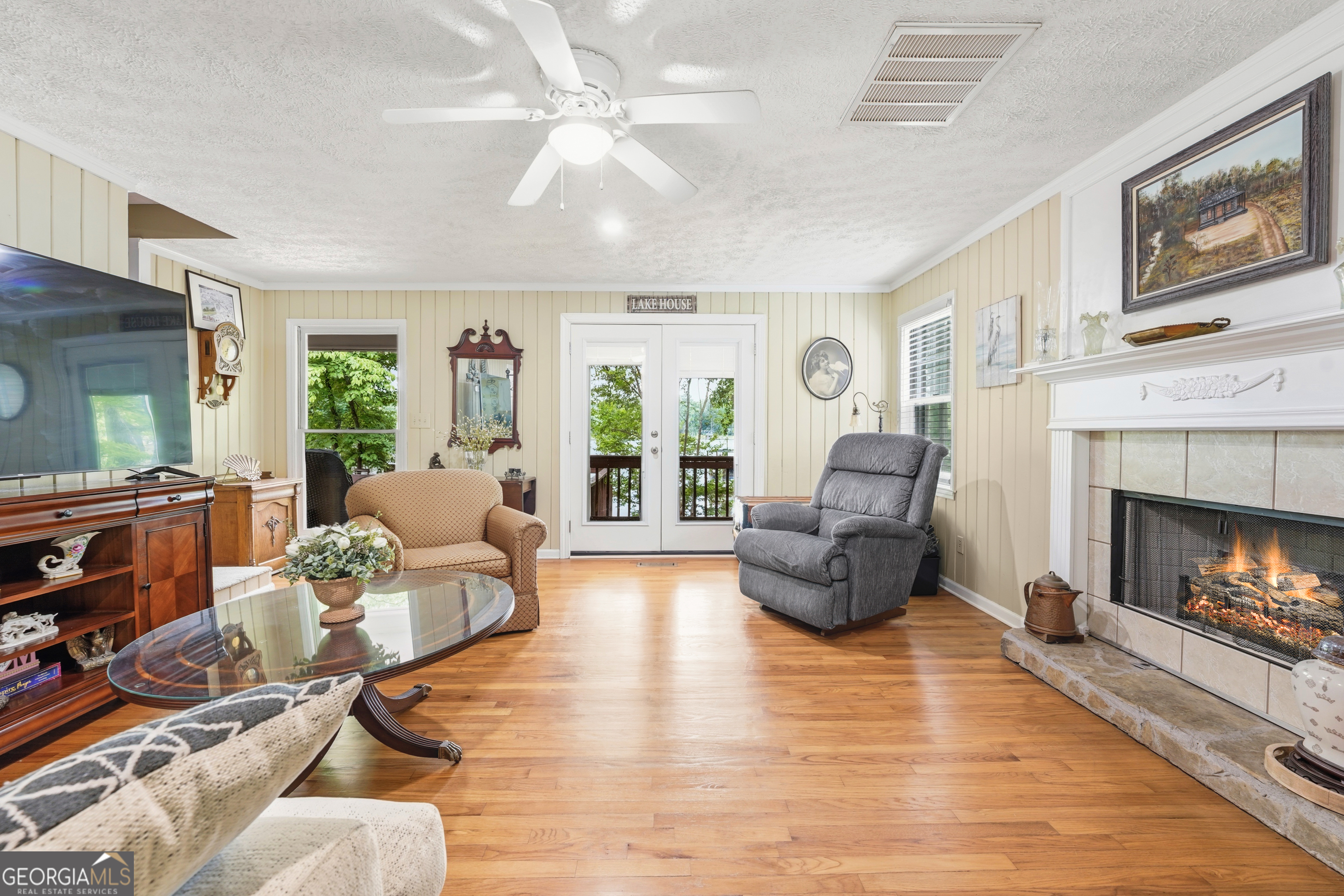 142 Tanglewood Road Southwest Eatonton, GA 31024 - Photo 14 of 50 a living room with furniture and a fireplace