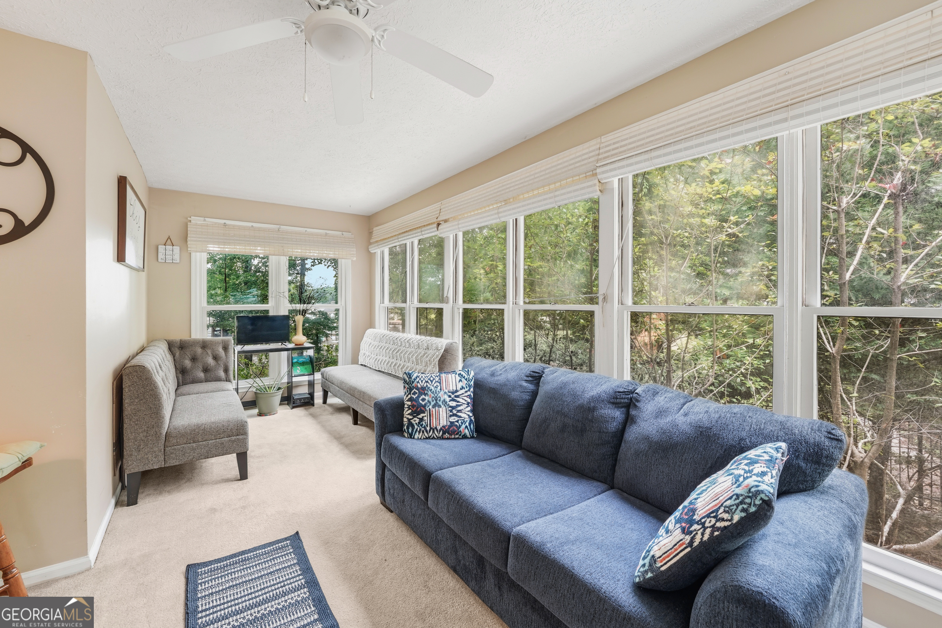 142 Tanglewood Road Southwest Eatonton, GA 31024 - Photo 15 of 50 a living room with furniture and a large window