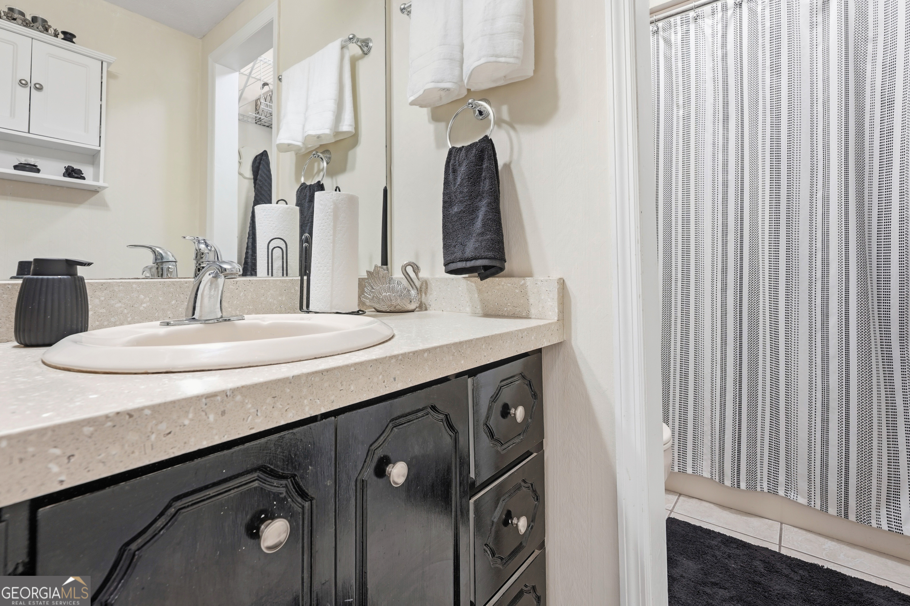 142 Tanglewood Road Southwest Eatonton, GA 31024 - Photo 19 of 50 a bathroom with a double vanity sink and a mirror