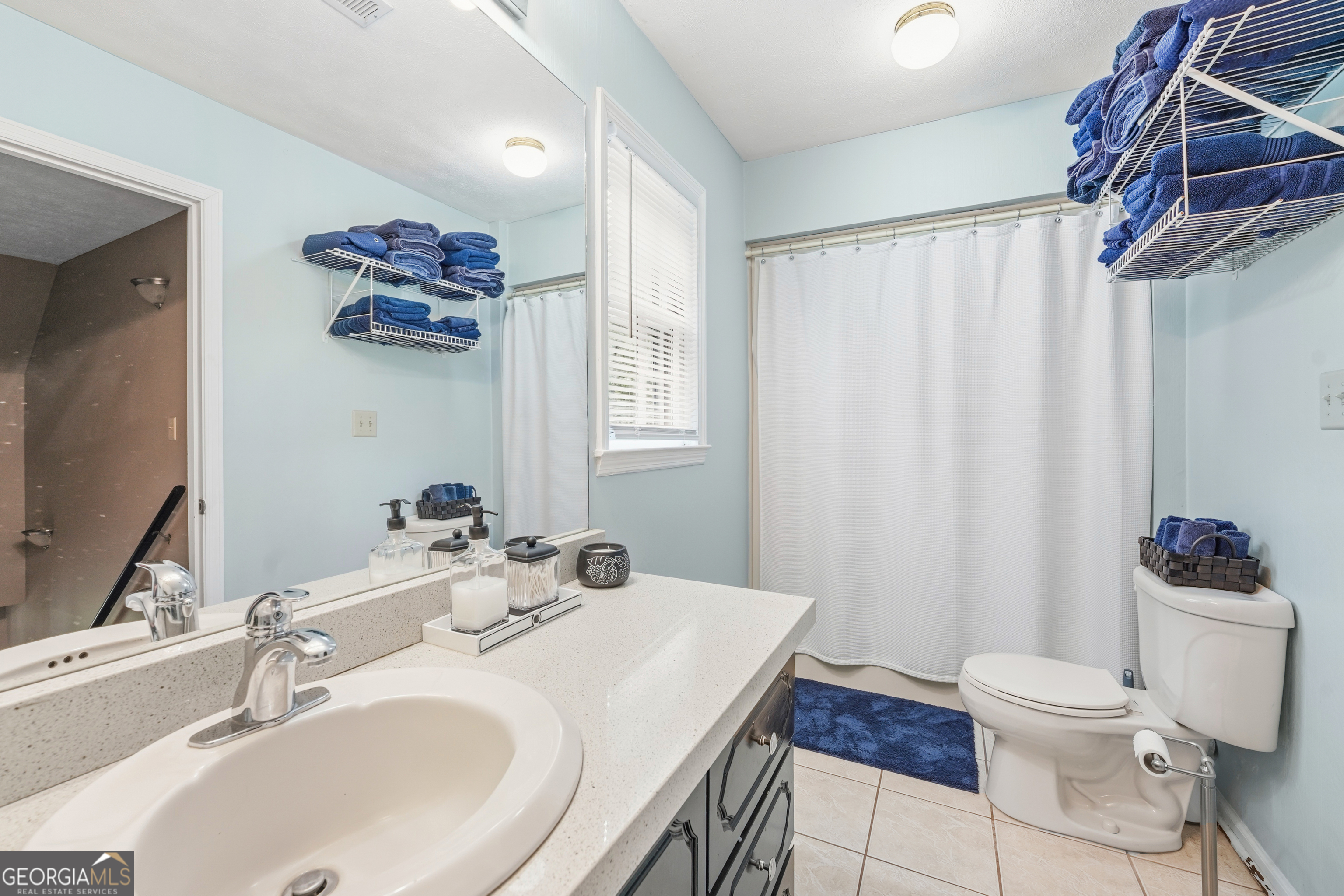 142 Tanglewood Road Southwest Eatonton, GA 31024 - Photo 23 of 50 a bathroom with a sink vanity mirror and toilet