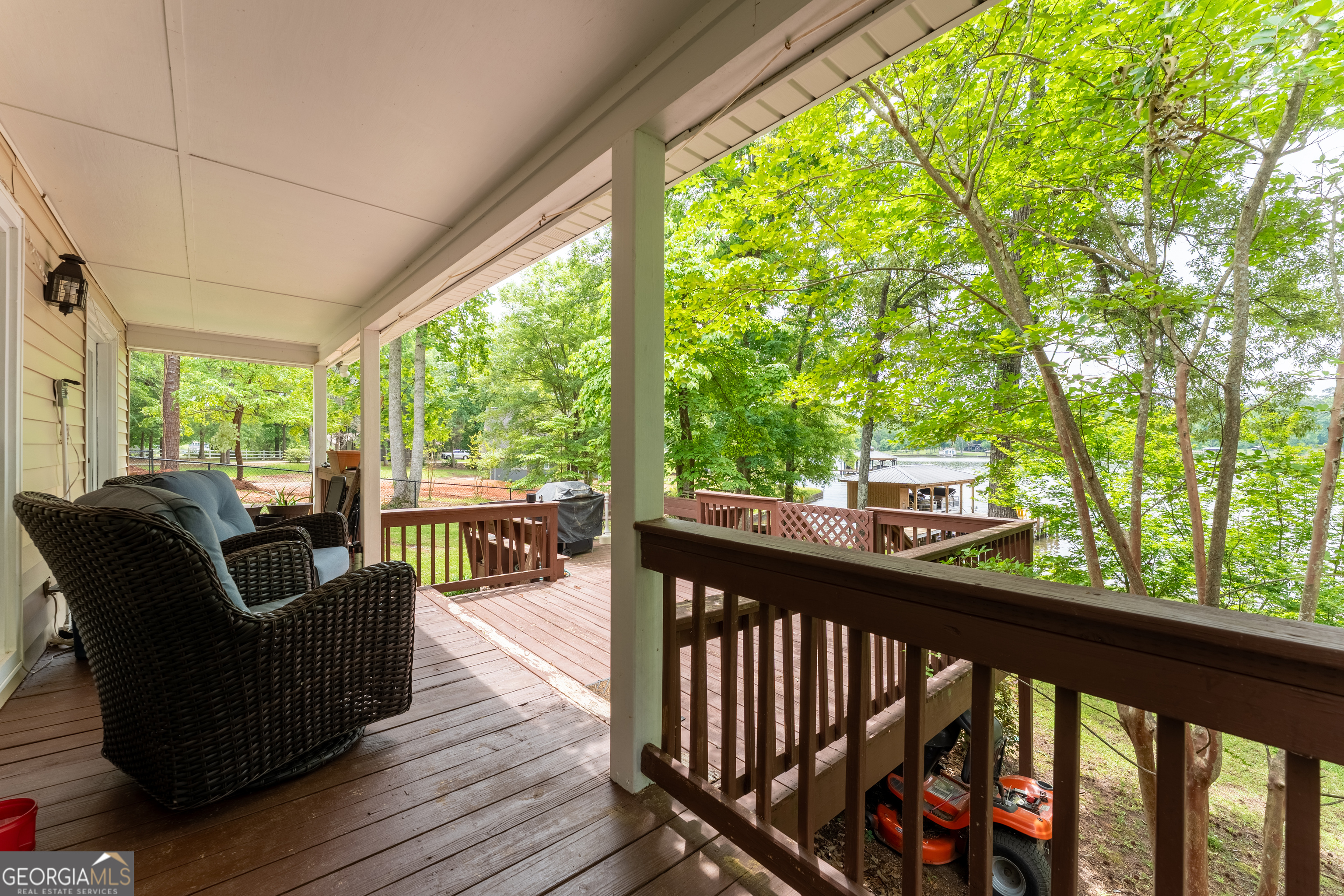 142 Tanglewood Road Southwest Eatonton, GA 31024 - Photo 28 of 50 a view of a chairs and couches in a balcony