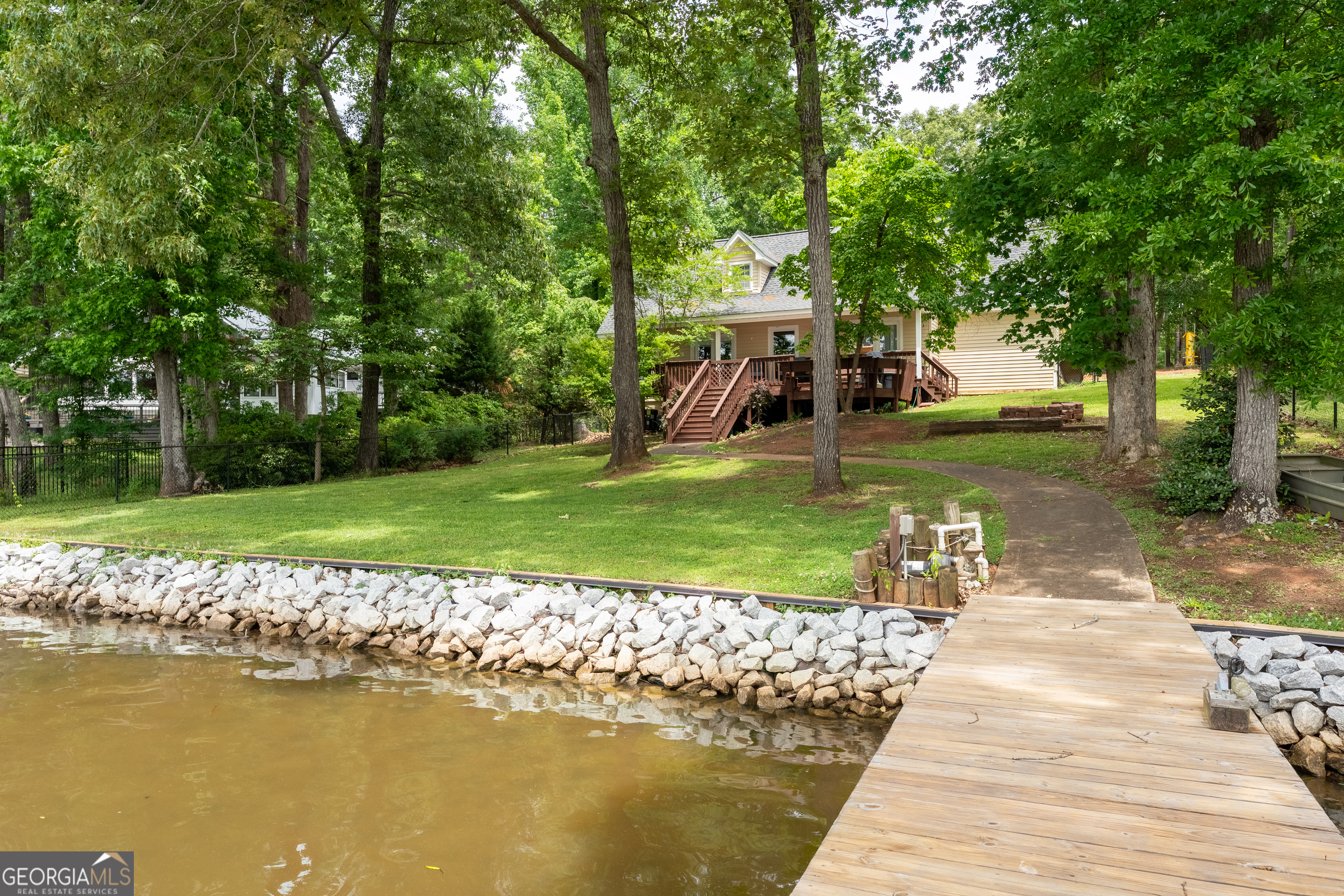 142 Tanglewood Road Southwest Eatonton, GA 31024 - Photo 40 of 50 a view of a house with a yard and sitting area