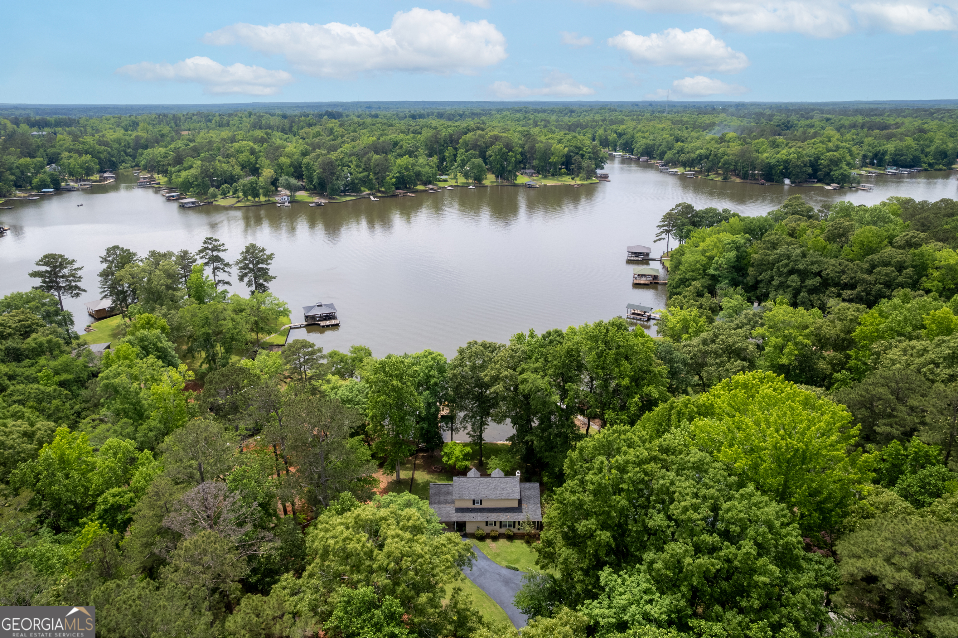 142 Tanglewood Road Southwest Eatonton, GA 31024 - Photo 41 of 50 an aerial view of a house with a lake view