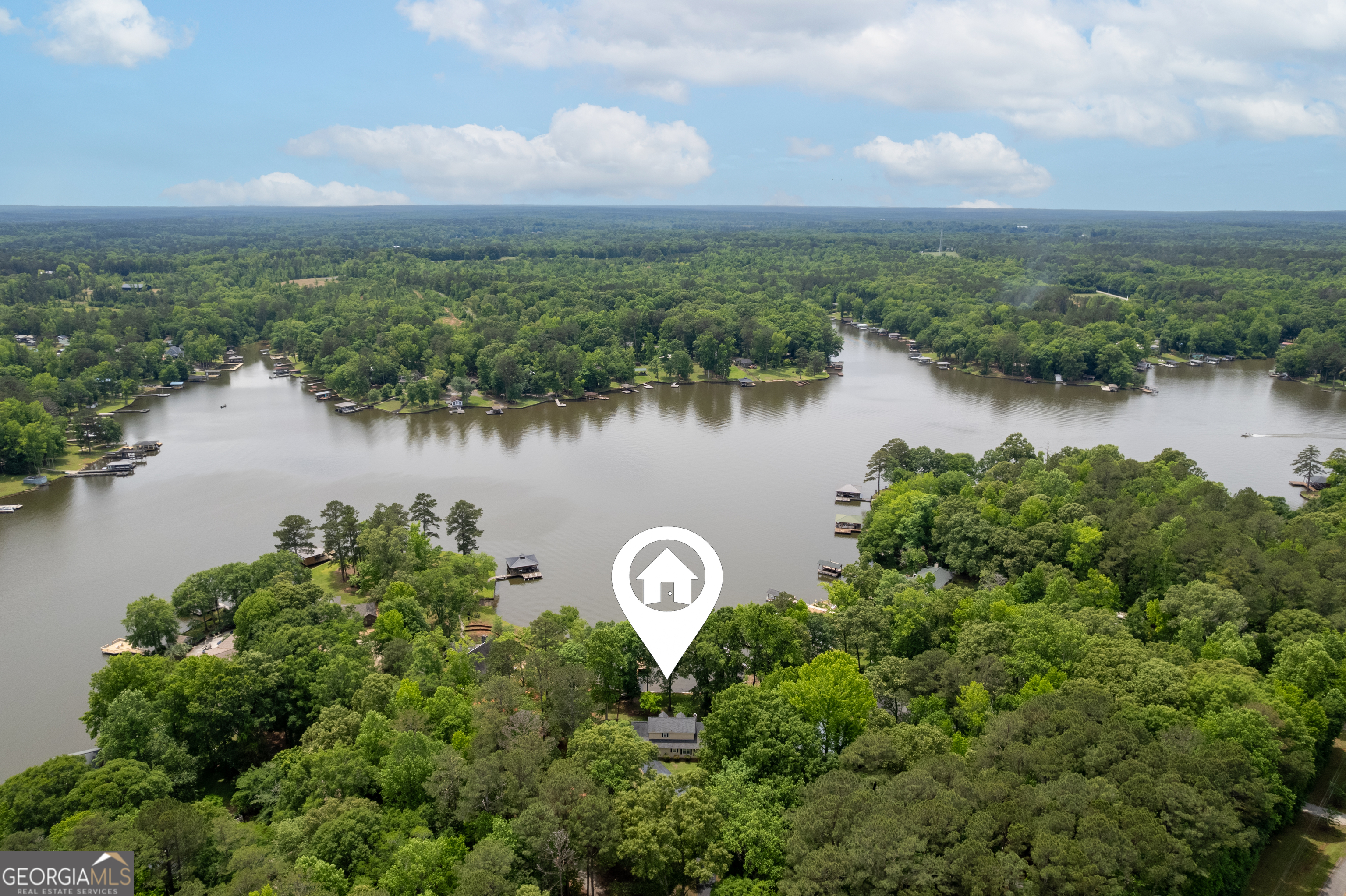 142 Tanglewood Road Southwest Eatonton, GA 31024 - Photo 42 of 50 a view of a lake with a city view