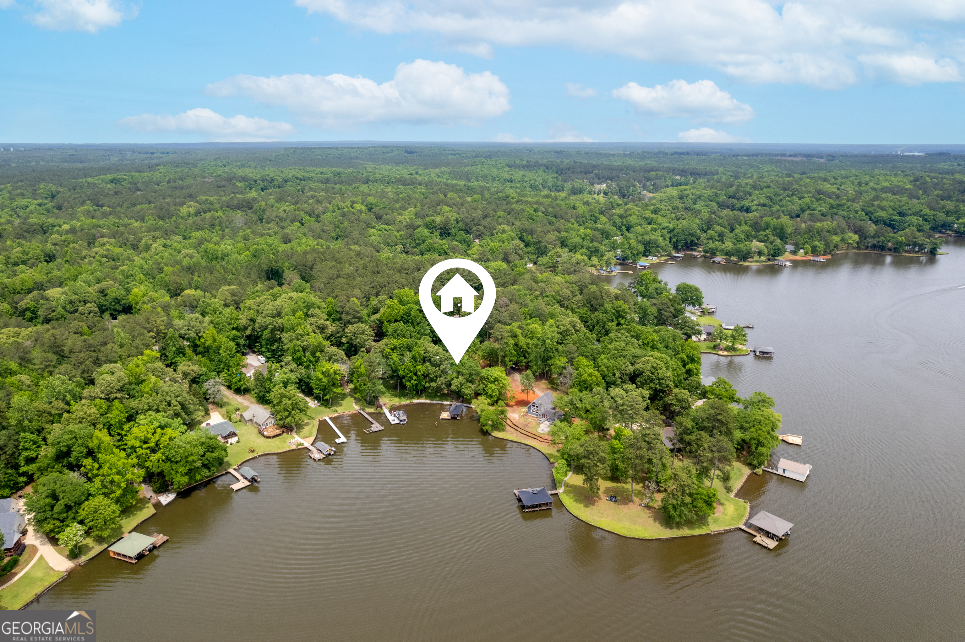 142 Tanglewood Road Southwest Eatonton, GA 31024 - Photo 46 of 50 a view of a lake with a mountain