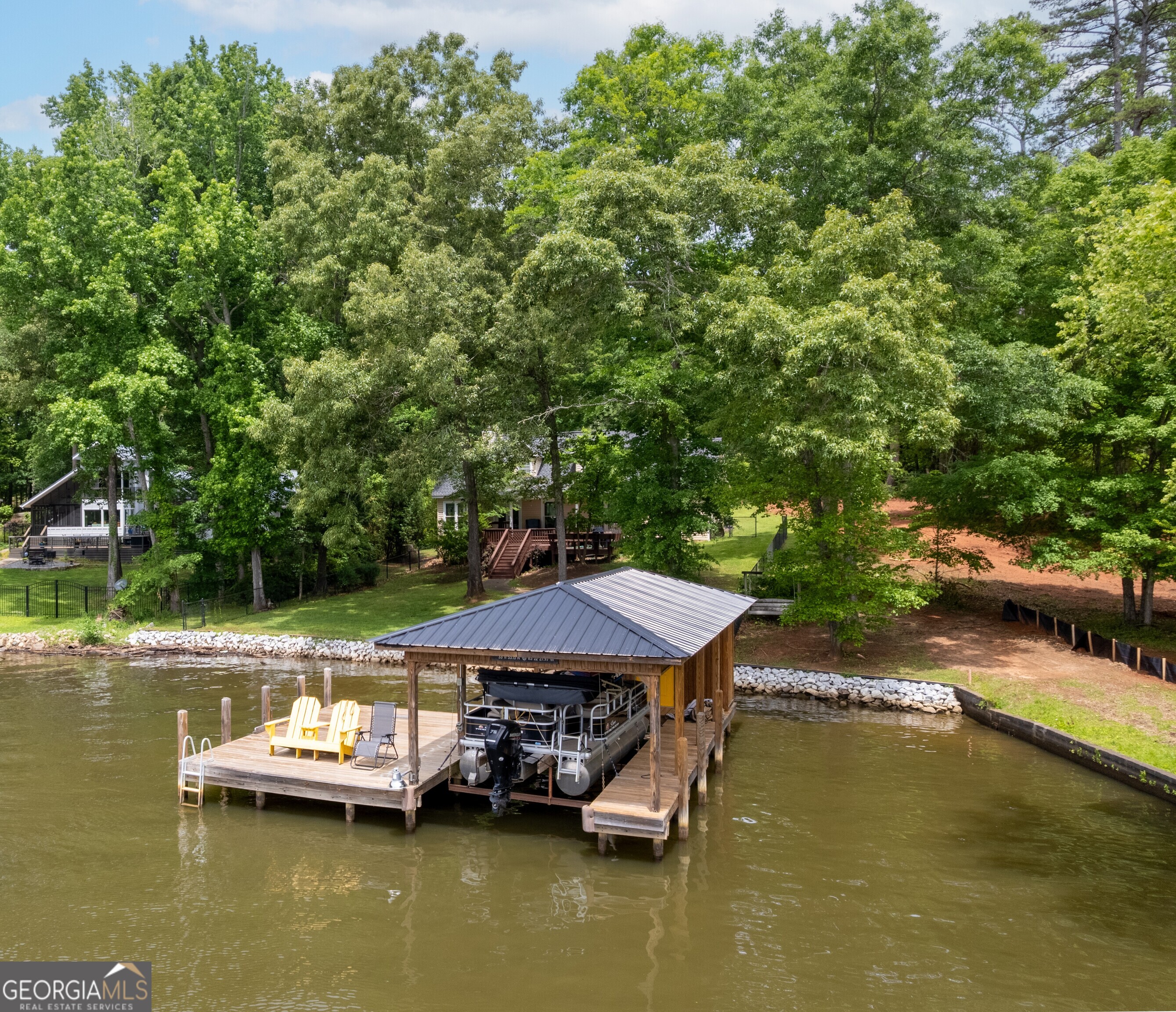 142 Tanglewood Road Southwest Eatonton, GA 31024 - Photo 47 of 50 an aerial view of a house with swimming pool a yard and lake view