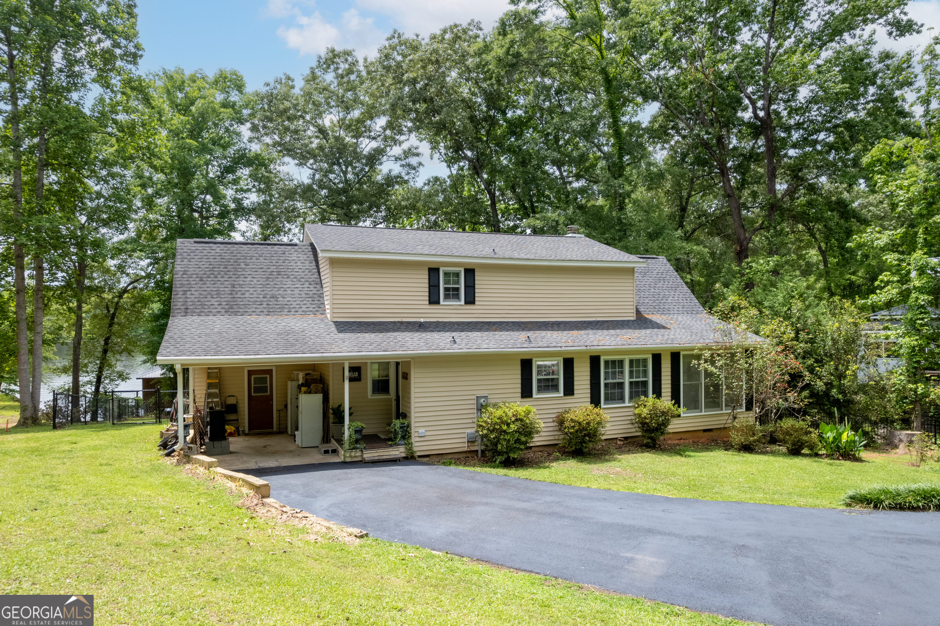 142 Tanglewood Road Southwest Eatonton, GA 31024 - Photo 6 of 50 a front view of a house with a yard and porch