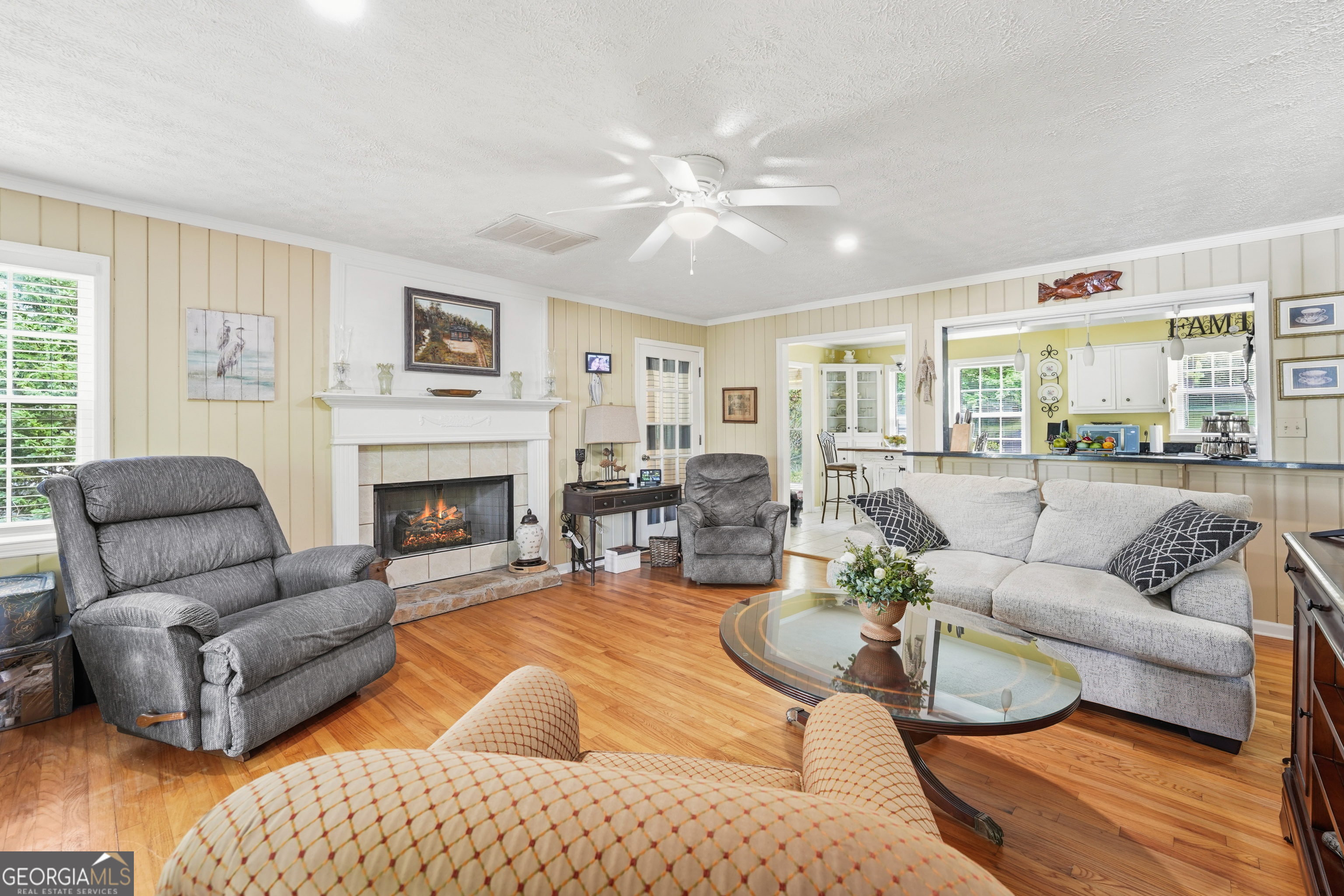142 Tanglewood Road Southwest Eatonton, GA 31024 - Photo 8 of 50 a living room with furniture and a fireplace