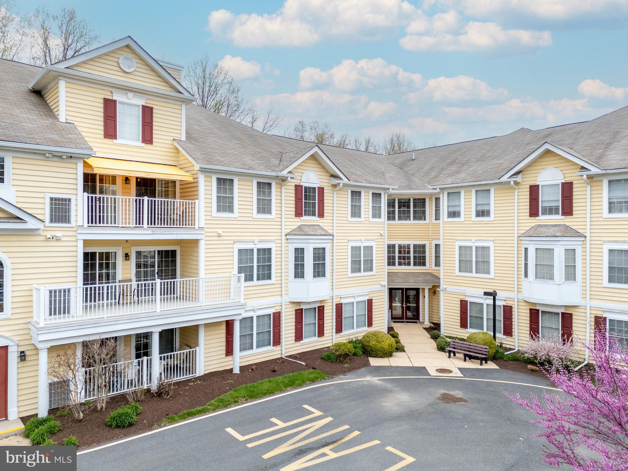 a front view of a building with street view