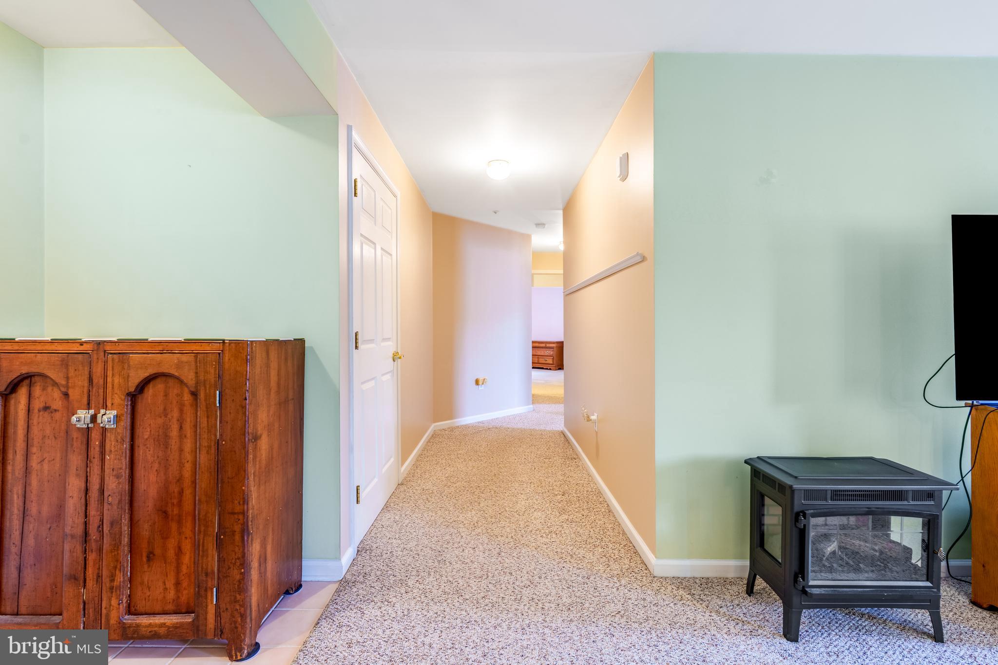 1305 Independence Way Newark, DE 19713 - Photo 13 of 25 a view of a hallway with wooden floor and furniture
