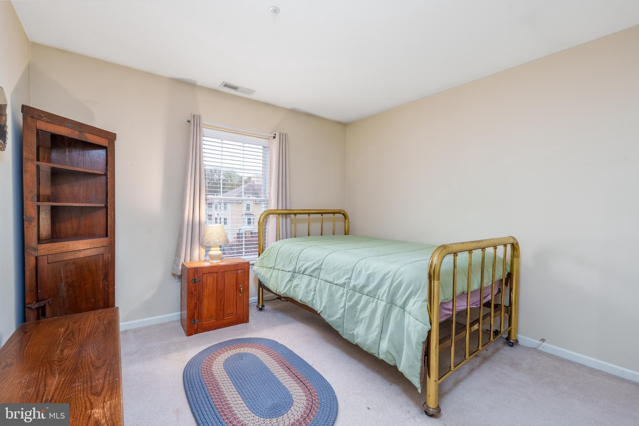 1305 Independence Way Newark, DE 19713 - Photo 15 of 25 a bedroom with a bed and a window