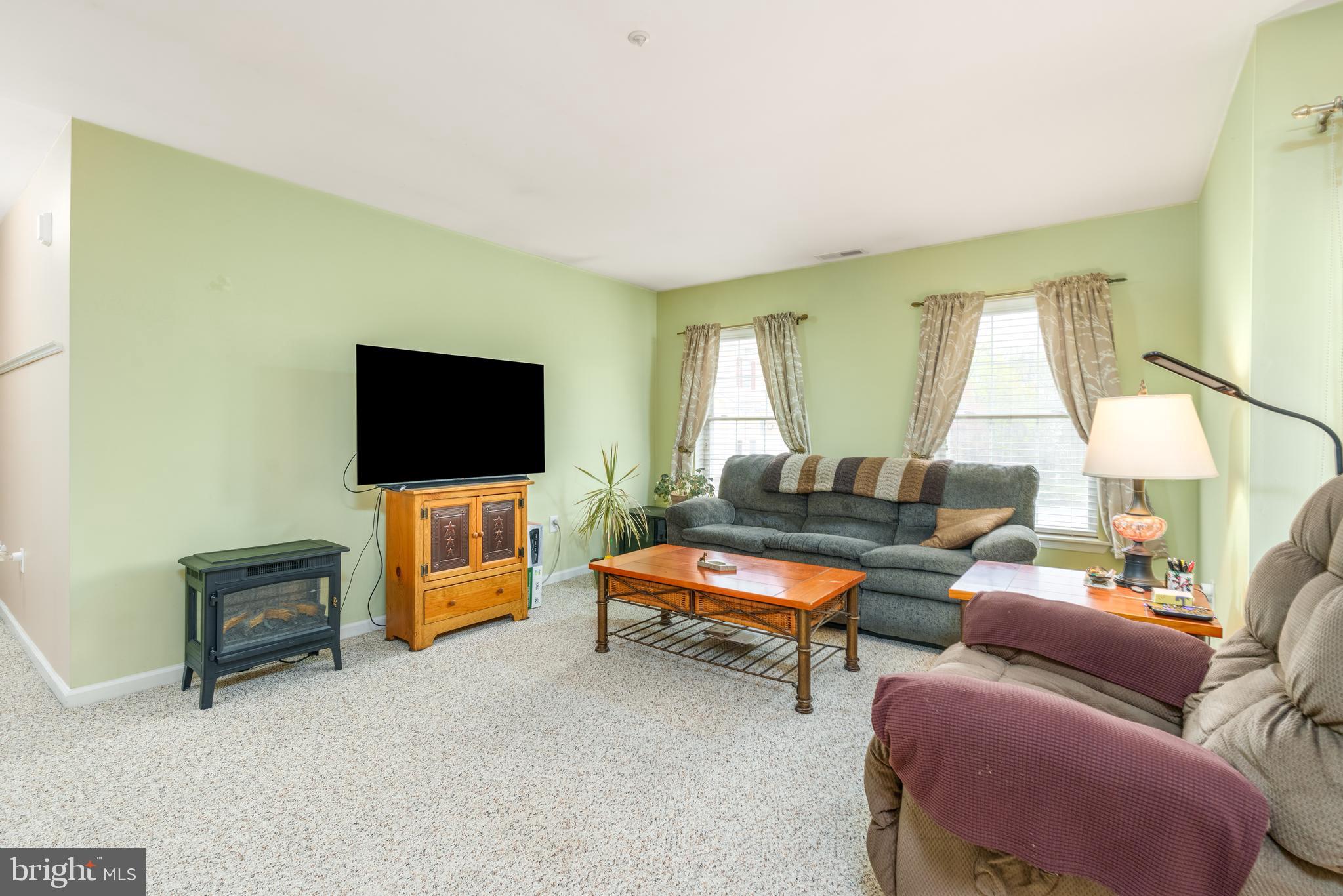 1305 Independence Way Newark, DE 19713 - Photo 3 of 25 a living room with furniture and a flat screen tv