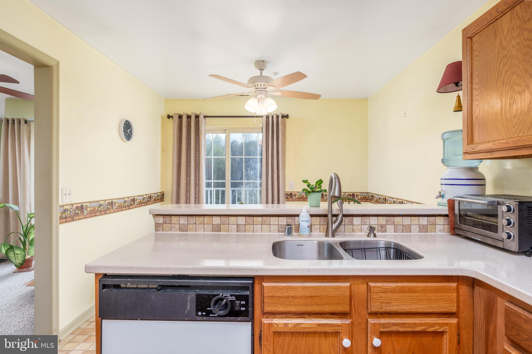 1305 Independence Way Newark, DE 19713 - Photo 7 of 25 a kitchen with a sink and a refrigerator